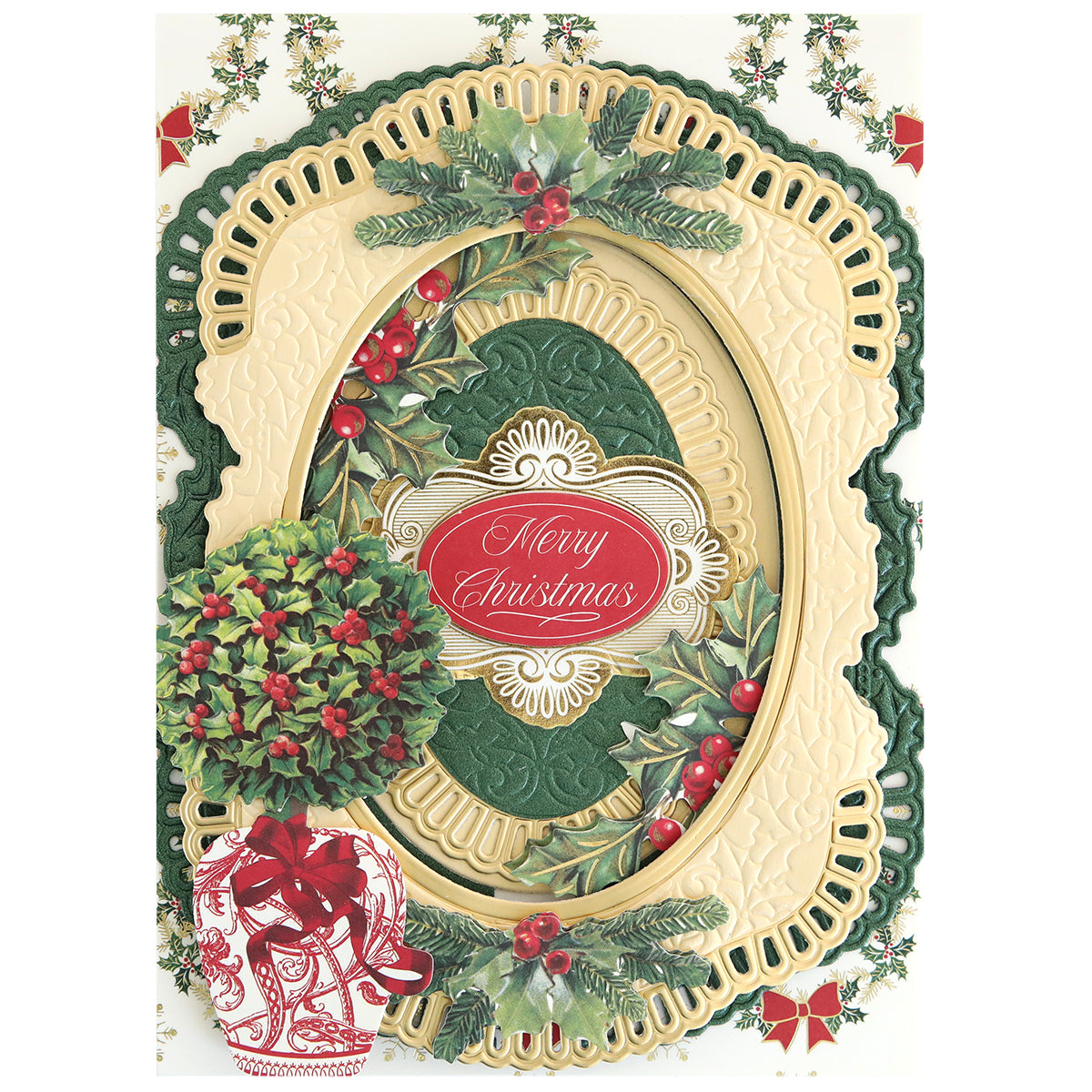 The Christmas Grace 3D Concentric Die Set creates ornate cream and green borders with holly and berries, perfect for cards or scrapbooks, and features a central "Merry Christmas" label in elegant script.