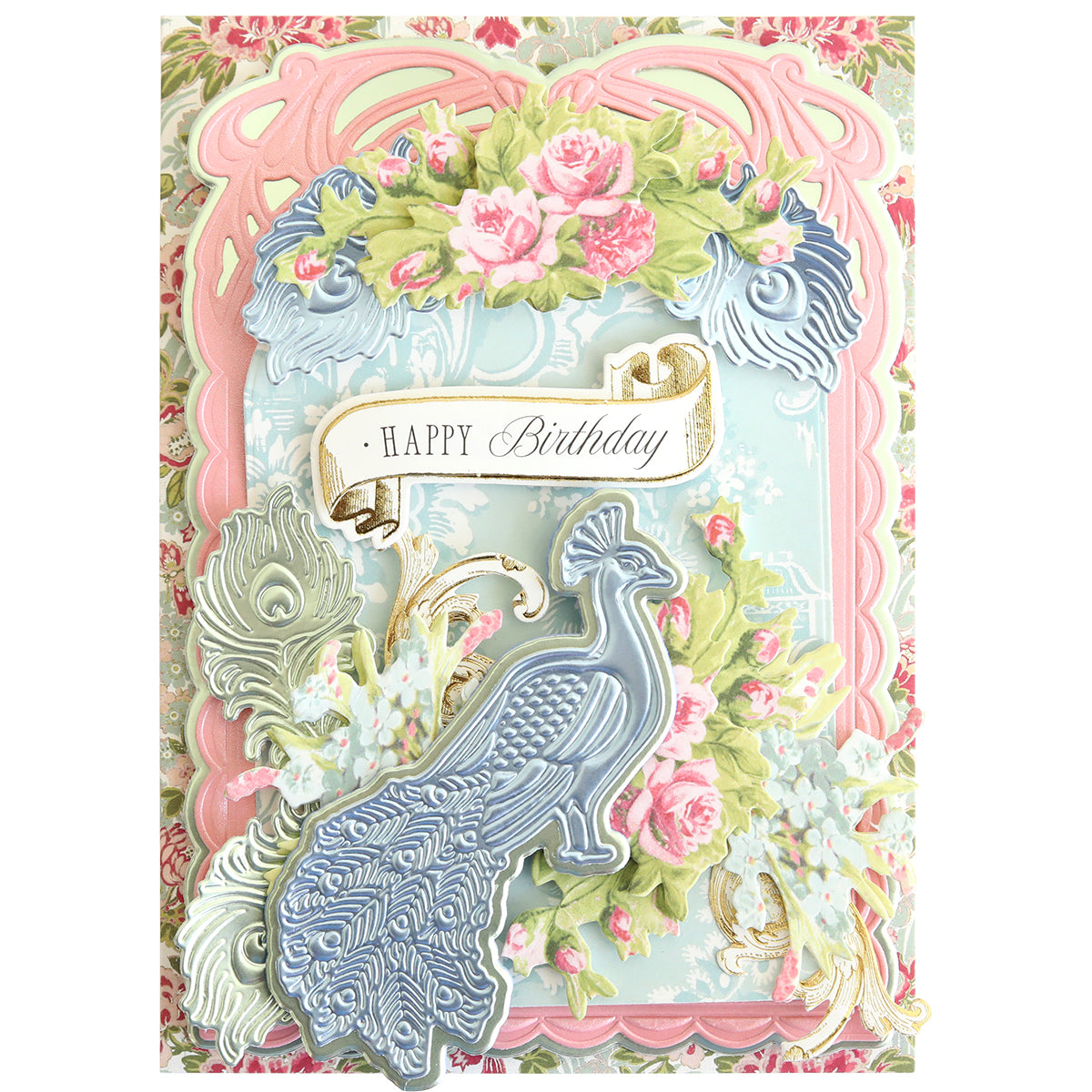Celebrate a birthday with an ornate card featuring a blue peacock, pink roses, green leaves, and a “Happy Birthday” banner on a pastel decorative background—beautifully crafted using the Peacock Scene 3D Dies layered die set with delicate embossing dies for stunning dimension.