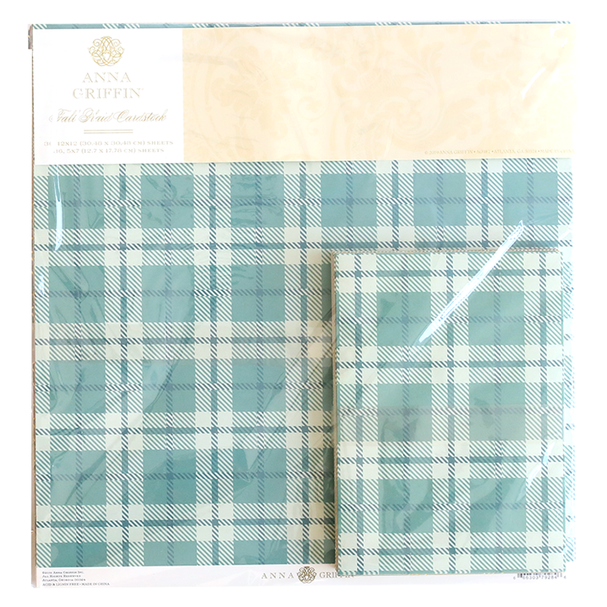 The Fall Plaid 5x7 and 12x12 Cardstock in blue and white, branded by Anna Griffin, captures cozy autumn trends with its packaging display.
