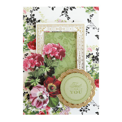 A card with flowers and a frame, featuring delicate borders, the Anniversary Stamp Set.