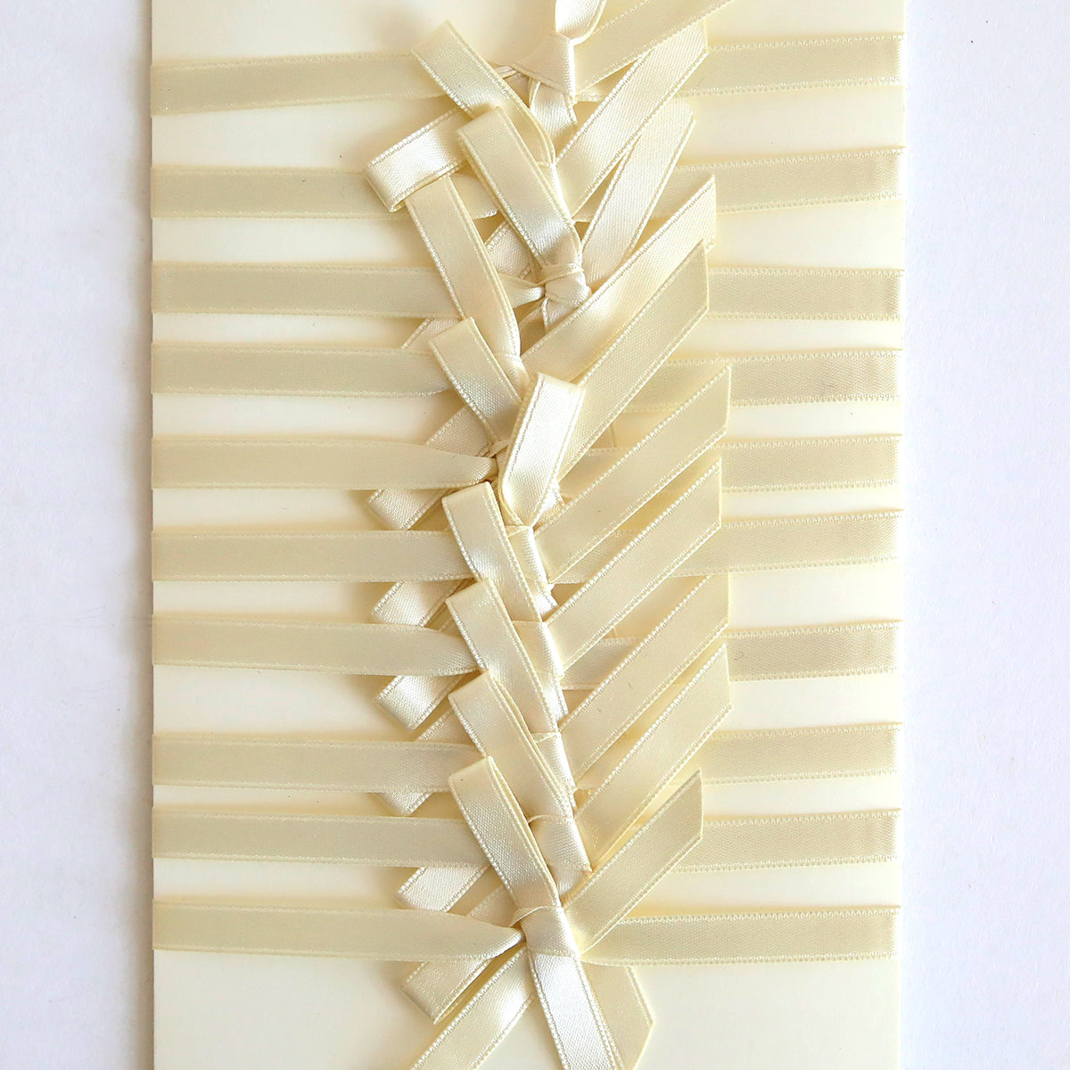 Ivory Satin Bows 10 count – Cream-colored cards adorned with pre-tied ivory satin bows woven in a diagonal crisscross pattern for a decorative, textured look.