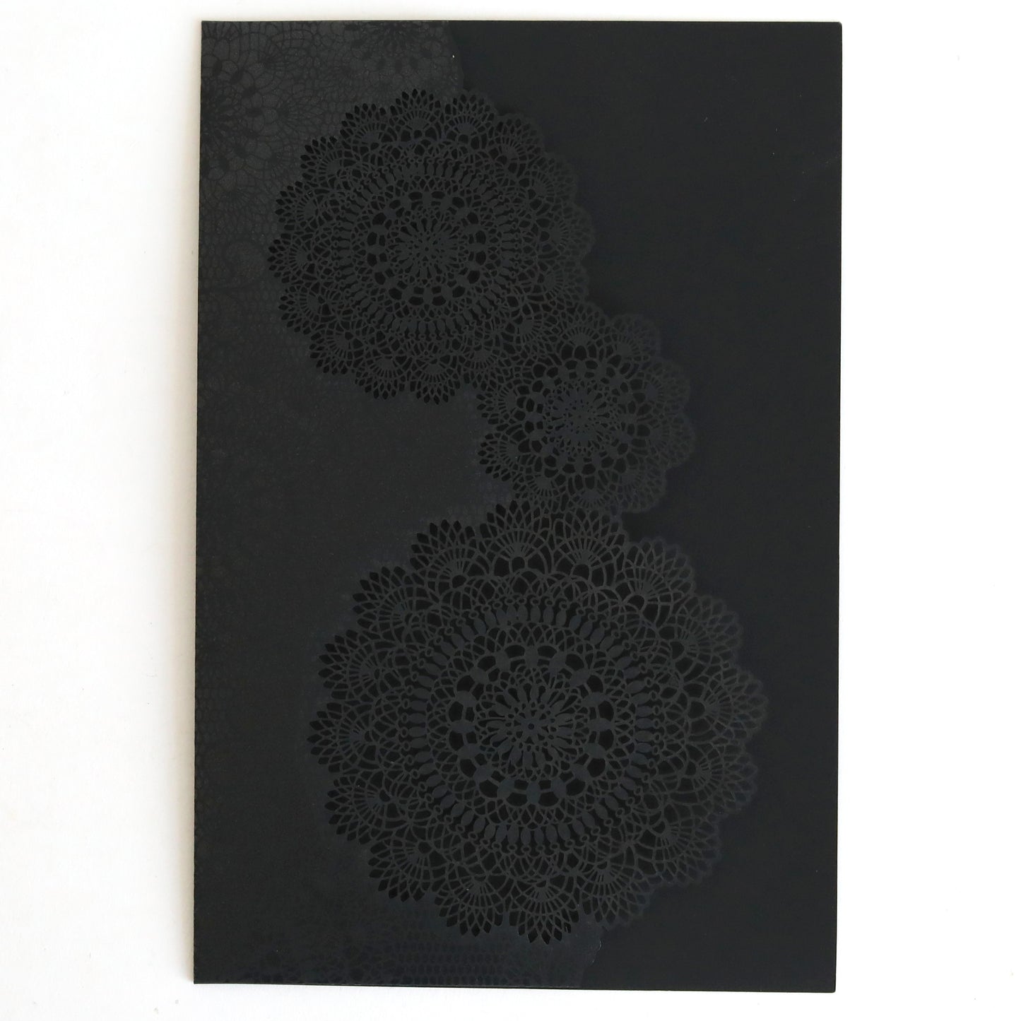 The Black Laser Cut Lace Pocket 10 pack features three intricate, glossy circular lace patterns on a matte black card—ideal for elegant wedding invitations or pairing with matching laser-cut pockets.
