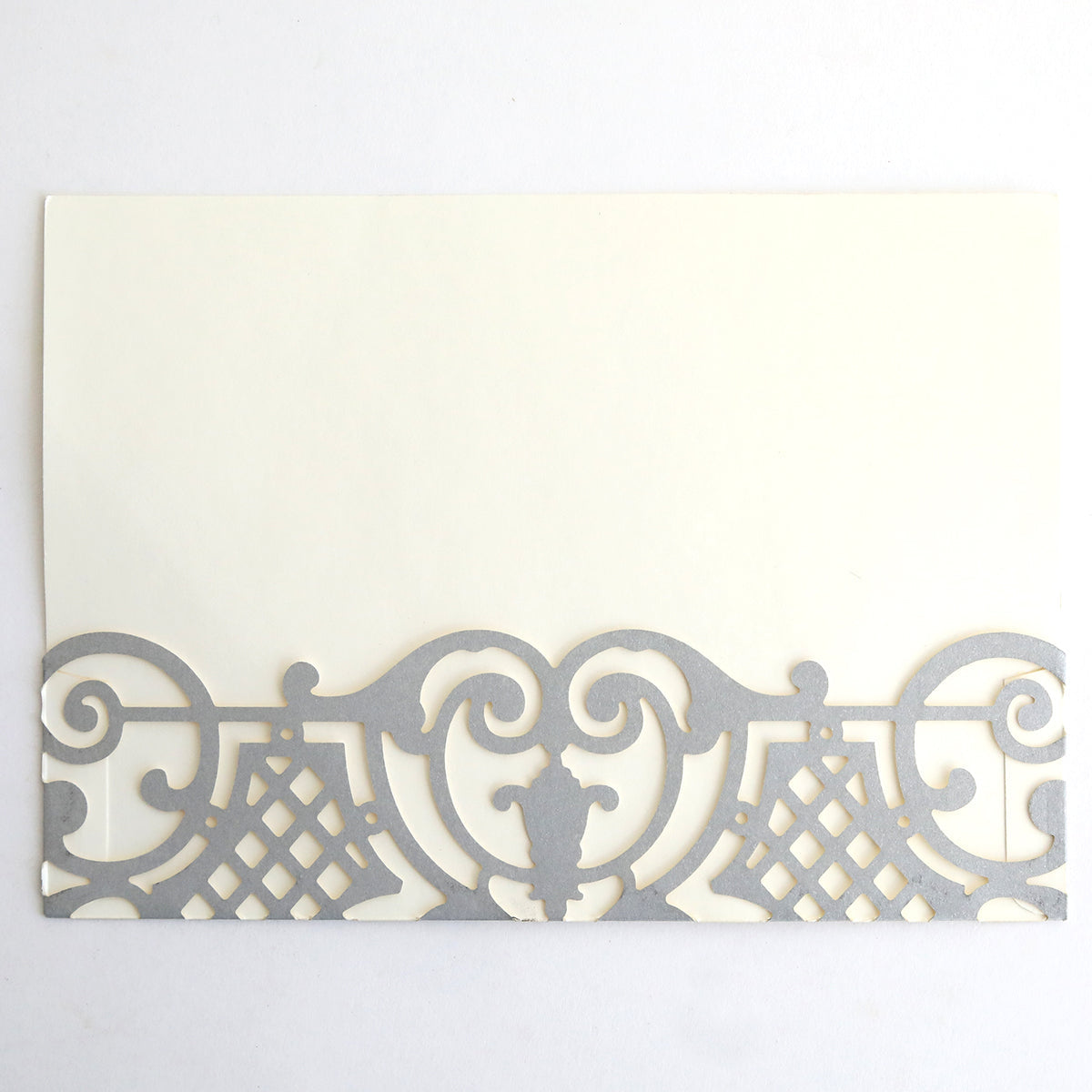 The Silver Diecut Pocket 10 pack features rectangular cream-colored cards with an ornate silver border along the bottom—ideal for elegant wedding or custom invitations with sophisticated style.