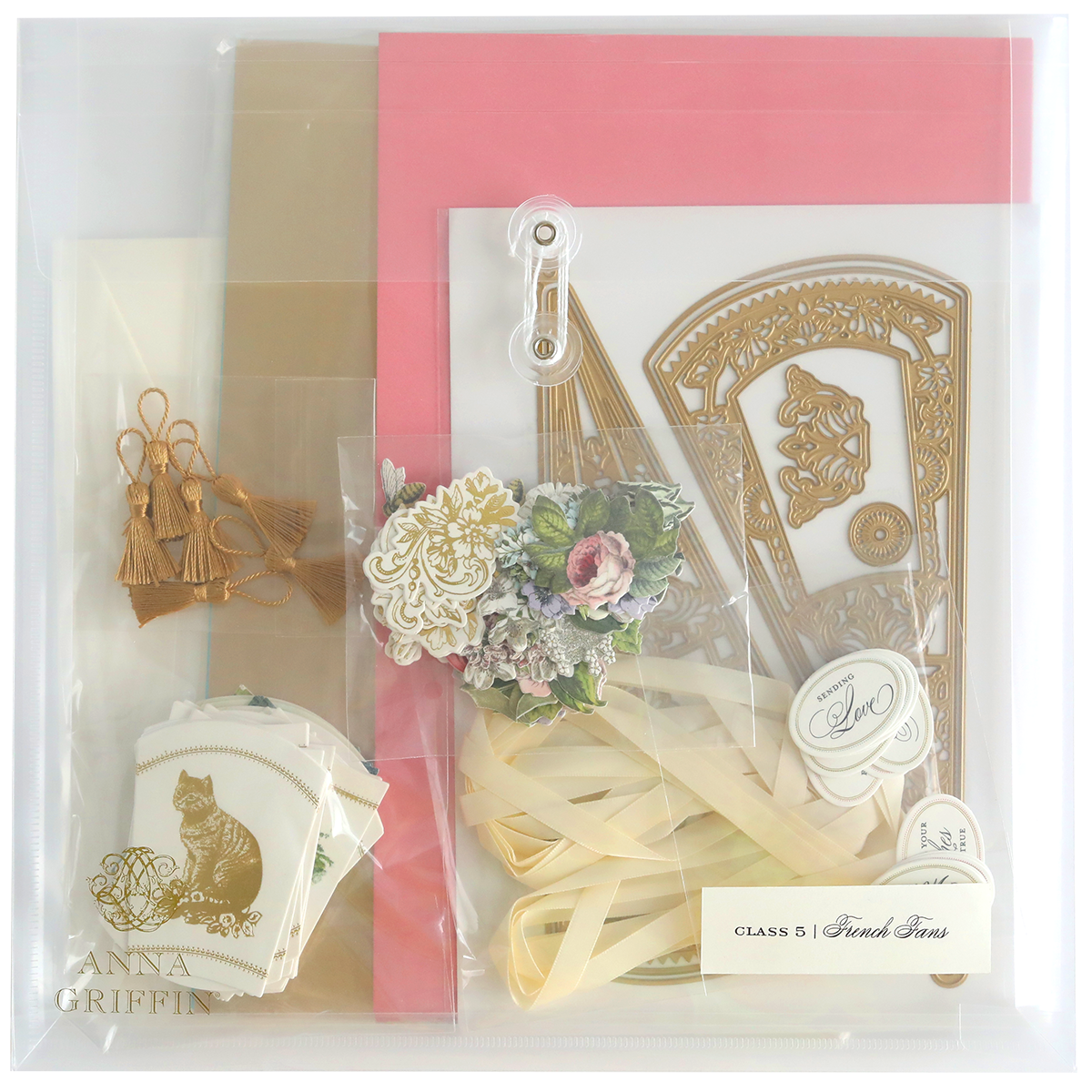 The French Fans Dies and Materials kit includes luxury matte foil cardstock, gold die cuts, pink and beige cardstock, floral embellishments, tassels, and ribbon. Unleash creativity and elegance with every piece.