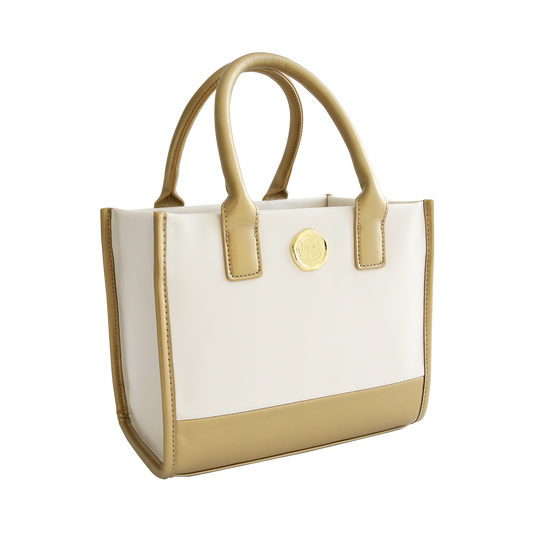 Empress Mini Machine tote bag with gold-tone accents and emblem, isolated on a white background.