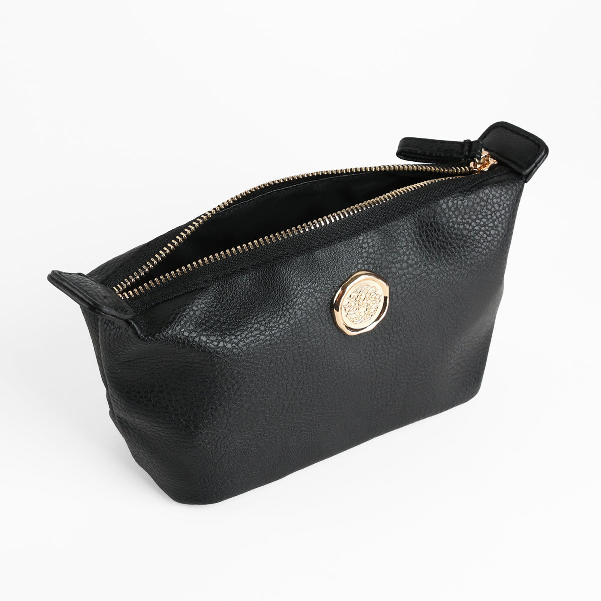The Onyx Black Small Cosmetic Bag features a textured black faux leather exterior, a gold emblem accent on one side, and a secure zippered closure. Shown open against a white background, it’s perfect as a chic cosmetic pouch or small makeup bag.