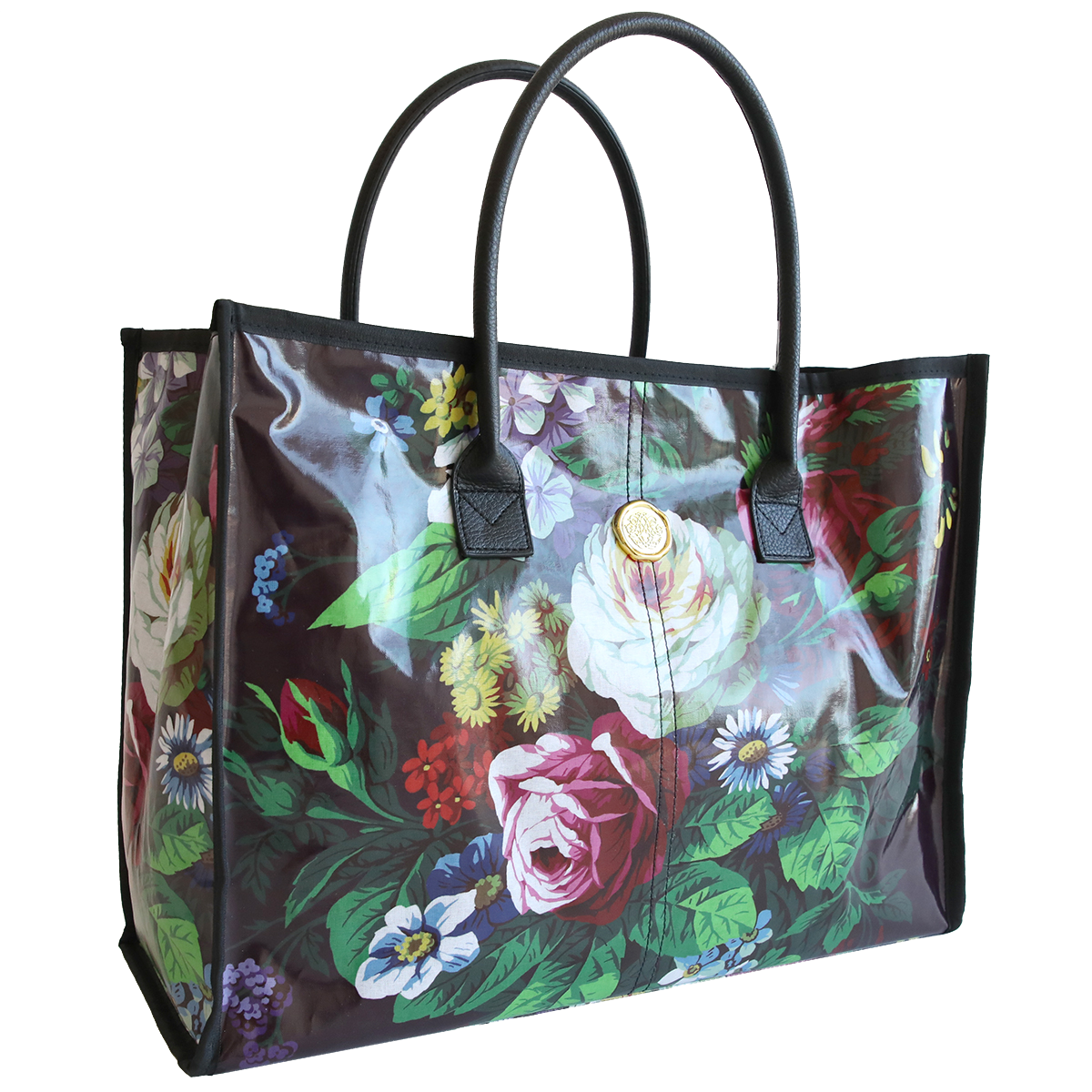 Transparent Astrid tote bag with a colorful floral print and black handles.