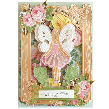 An ornate greeting card featuring 3D Fairy Scene Dies sprinkled with pixie dust and the words "with gratitude" at the bottom.