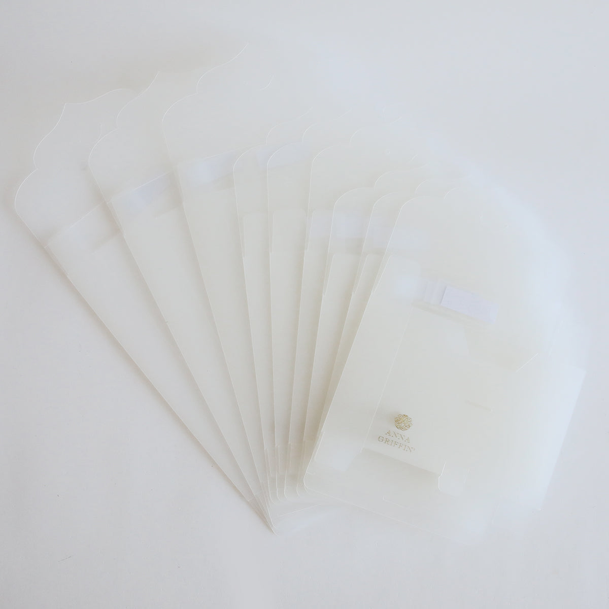 A stack of Frosted Craft Storage Boxes 9 count on a white surface, perfect for craft storage.