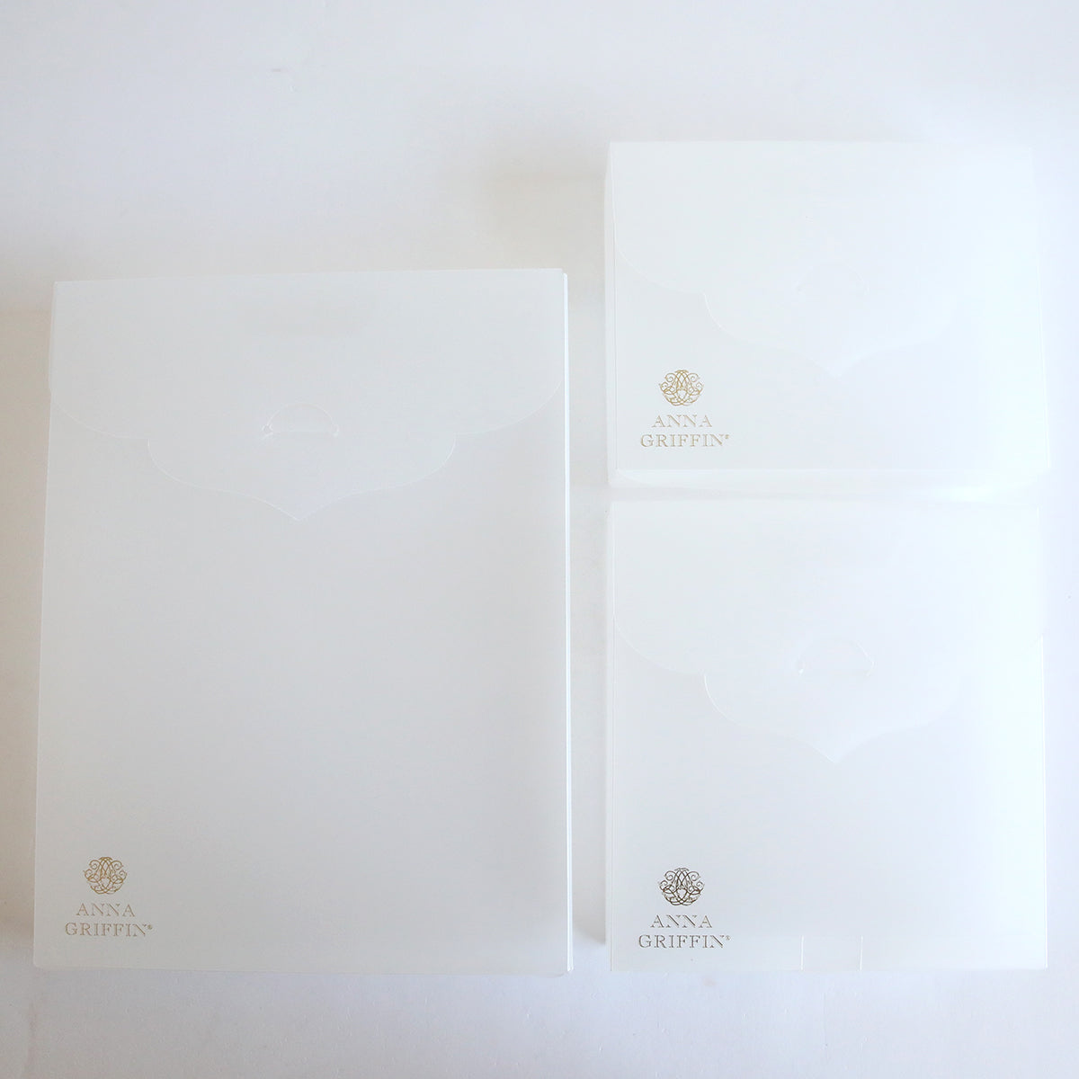 A set of Frosted Craft Storage Boxes 9 count with a logo on them, perfect for craft storage.