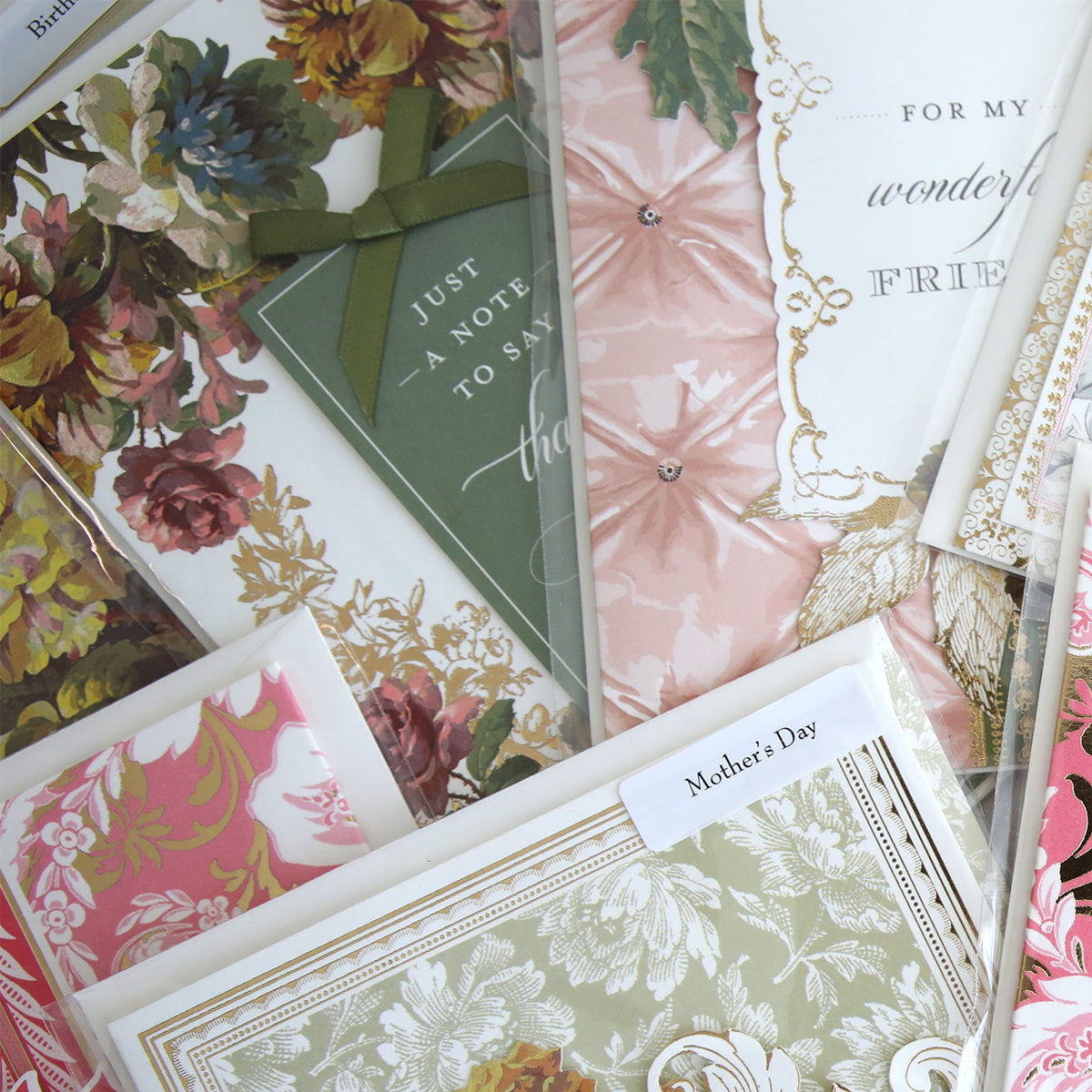 The Handmade Card Assortment features a close-up view of unique greeting cards, including dimensional and handmade designs for Mother’s Day and friends.