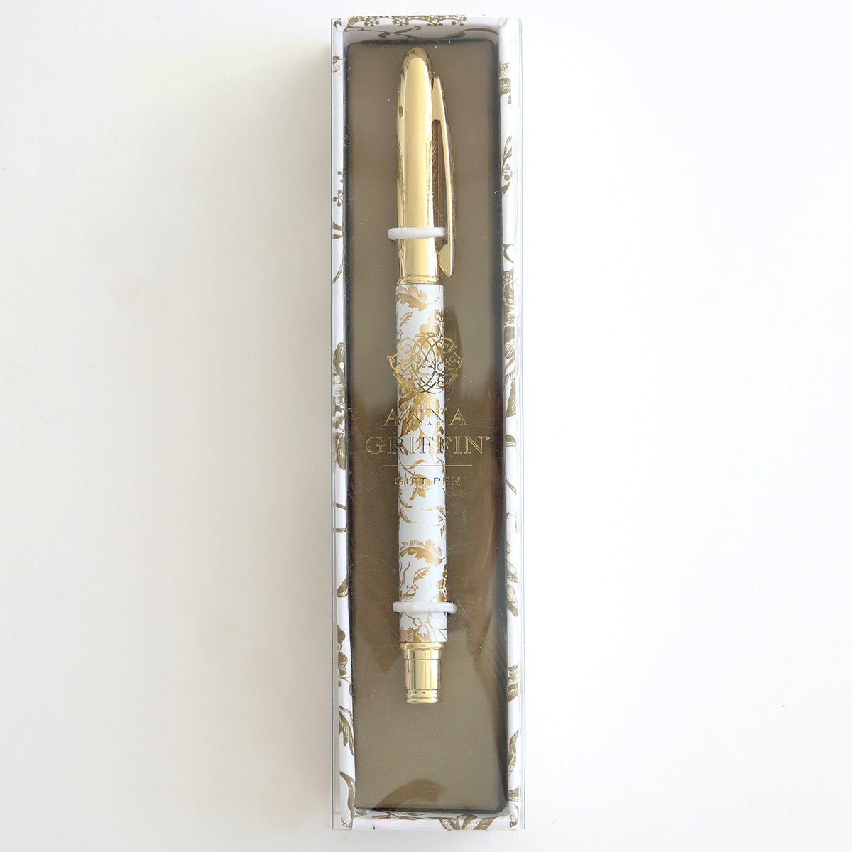 The Gold Climbing Rose Gift Pen, adorned with gold and white floral designs, is displayed in a rectangular box—ideal for any stationery enthusiast.