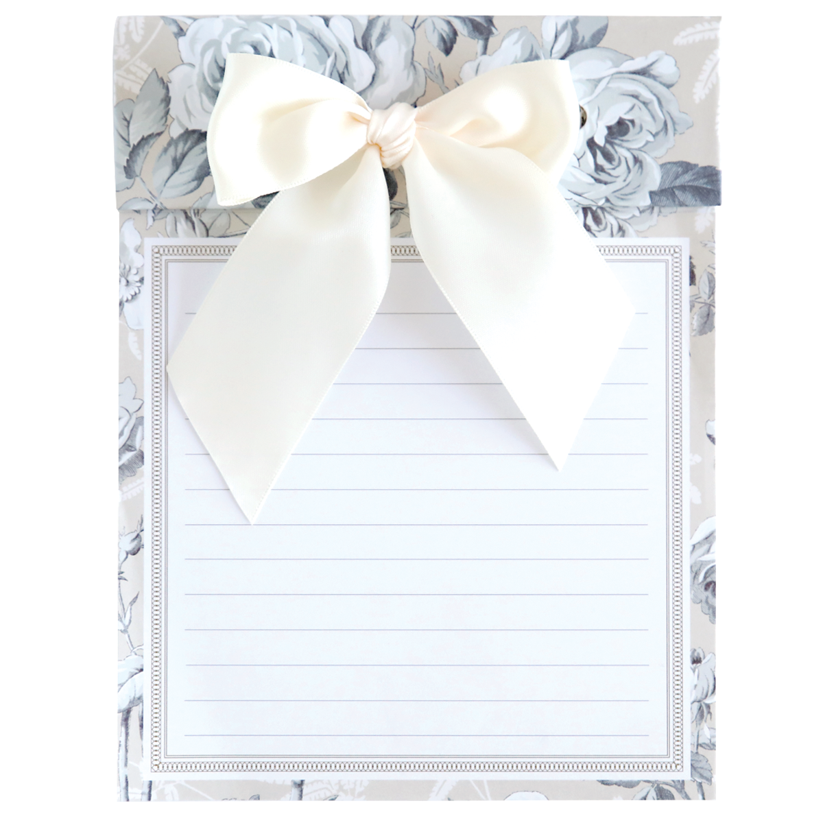 The Faded Rose Bow Pad, a 6" x 8" lined notepad, boasts an ornate floral background and a large cream bow, blending elegance and functionality.