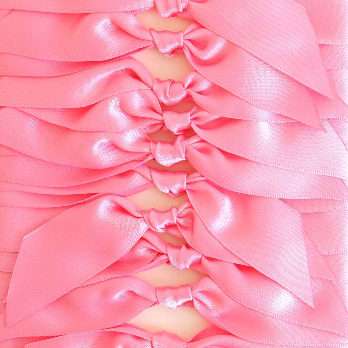 Add a touch of elegance to handmade cards or crafts with Pink Satin Knots 10 count—rows of neatly tied, shiny double-faced satin bows arranged in a repeating pattern. Perfect for decor or as pre-tied ribbons.