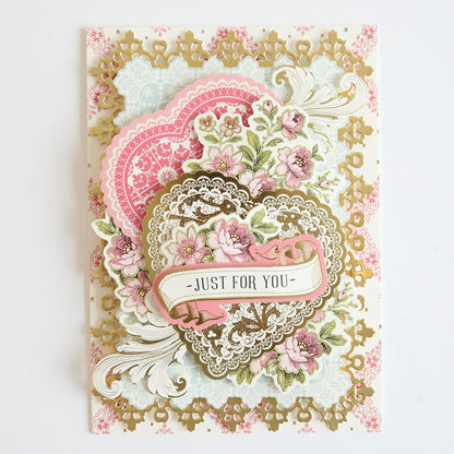 A vintage Valentine's card adorned with delicate pink flowers and Lace Doily Embellishments for added dimension and texture.