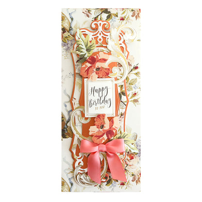 A Bright Matte Foil Cardstock birthday card with a shimmering bow and flowers.