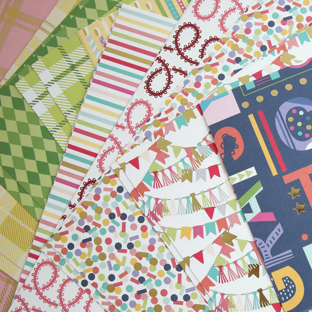 The Mystery Birthday 12x12 Cardstock features assorted sheets with stripes, plaid, polka dots, banners, and abstract shapes in vibrant colors—ideal for creative birthday crafting projects.
