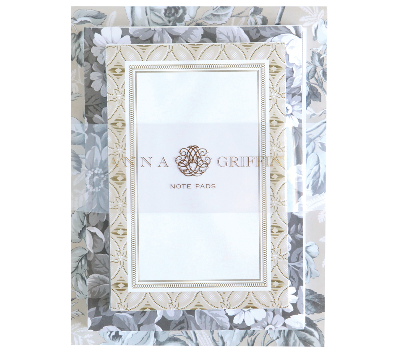 The Faded Rose Note Pad Set features a stack of note pads with floral patterns and ornate borders, labeled "Note Pads." This large pad offers 300 sheets, perfect for jotting down notes or doodling.