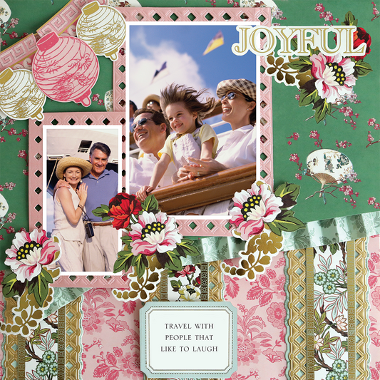 The 12x12 Scrapbook Page Lian Green Bottom Stripe Left highlights two family photos, floral patterns, realistic paper crafting, paper lanterns, the word "JOYFUL," and the phrase "TRAVEL WITH PEOPLE THAT LIKE TO LAUGH.