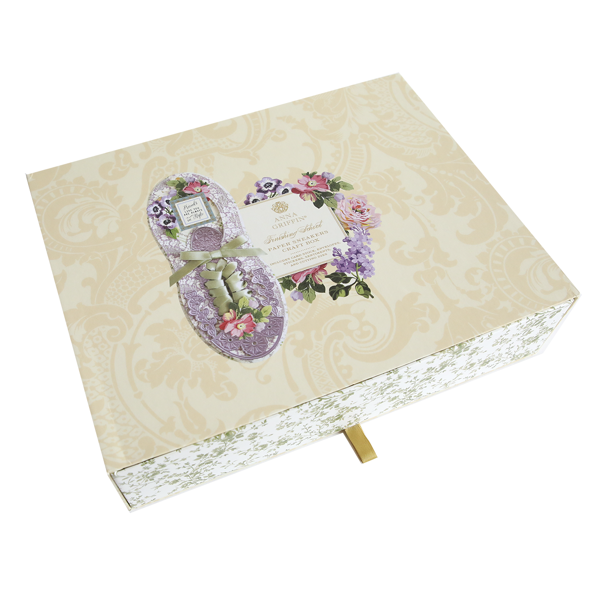 A floral-themed greeting card in the shape of Paper Sneakers on a patterned beige background with a gold ribbon, inspired by paper sneakers.