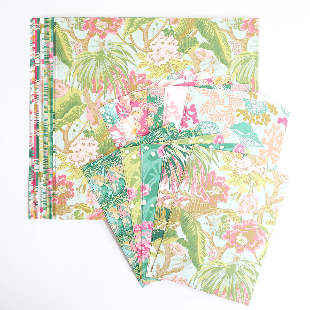The Paradise Cardstock Collection features pastel floral and leaf designs, perfect for summer crafts. Sheets are displayed fanned out on a white background.