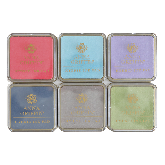 A collection of five Perfect Palette Inks with different colors for stamping.