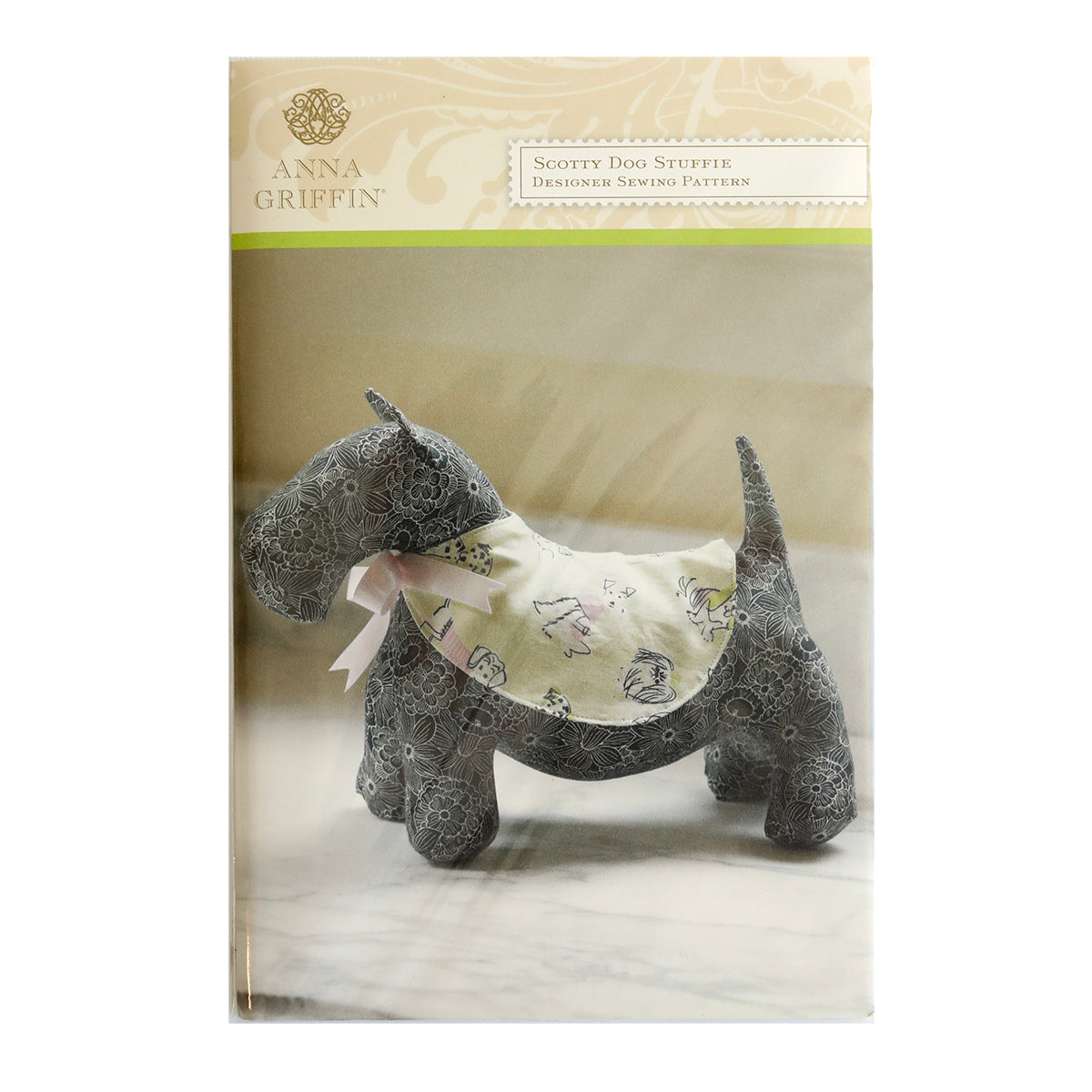 A Dog Stuffy Pattern wearing a pink collar is featured in the Anna Griffin Sewing Pattern Collection.