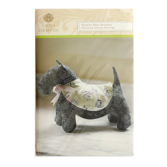 A Dog Stuffy Pattern wearing a pink collar is featured in the Anna Griffin Sewing Pattern Collection.