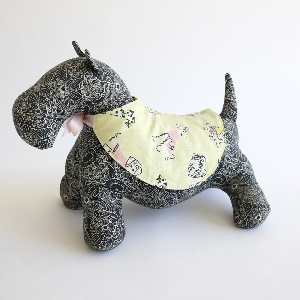 A Dog Stuffy Pattern with a yellow and black collar.