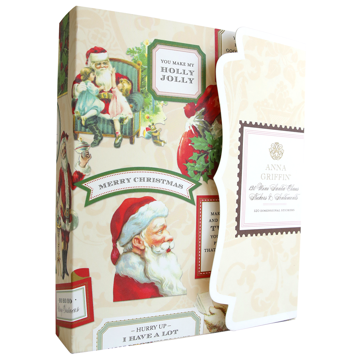 A decorative box featuring Santa & Sentiment Stickers sits next to an ornate Anna Griffin card with a printed address.
