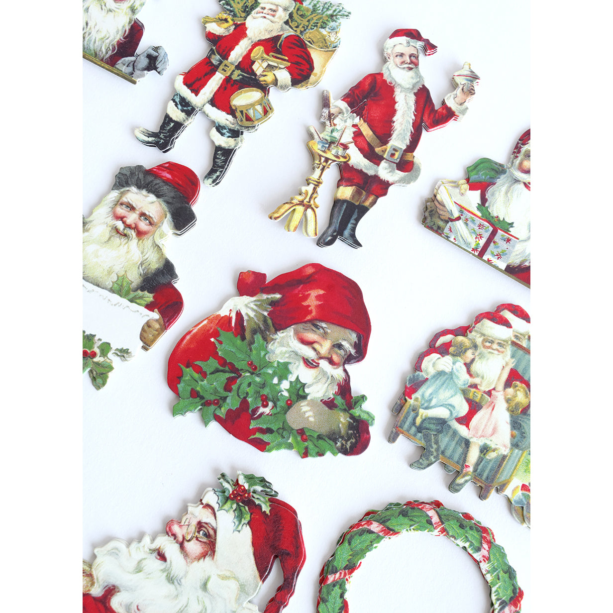 Santa & Sentiment Stickers feature vintage Santa Claus in various poses and outfits on a white background—ideal for adding festive charm to Christmas cards or sentiment stickers.
