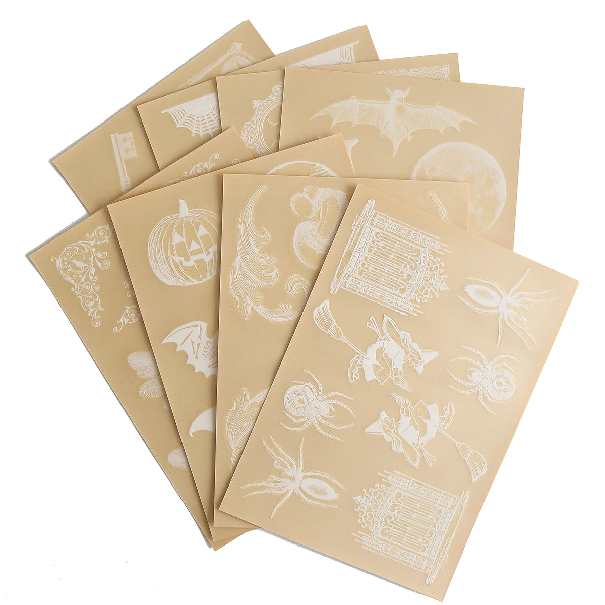 The Scary White Rub On Transfers product includes a set of eight beige sheets adorned with various white-ink designs such as pumpkins, bats, spiders, birds, and intricate patterns—ideal for crafting Halloween-themed handmade cards.