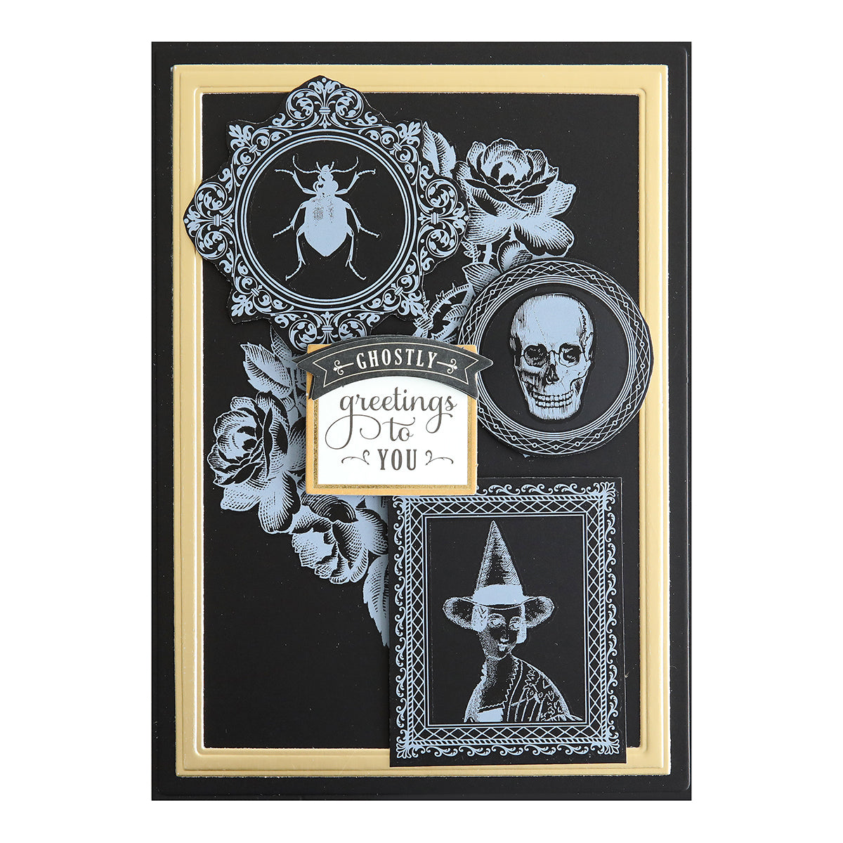 A handmade Halloween card adorned with a beetle, skull, and witch in ornate frames showcases the message "Ghostly greetings to you" at its center. The intricate details are elevated with the use of Scary White Rub On Transfers for an extra spooky touch.