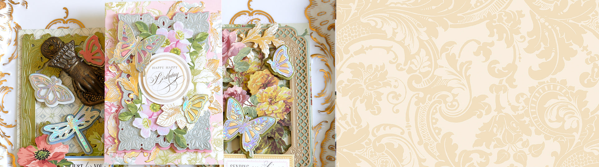 A floral greeting card with pink roses and gold accents stands upright in front of a decorative porcelain plate with a pink rose pattern.