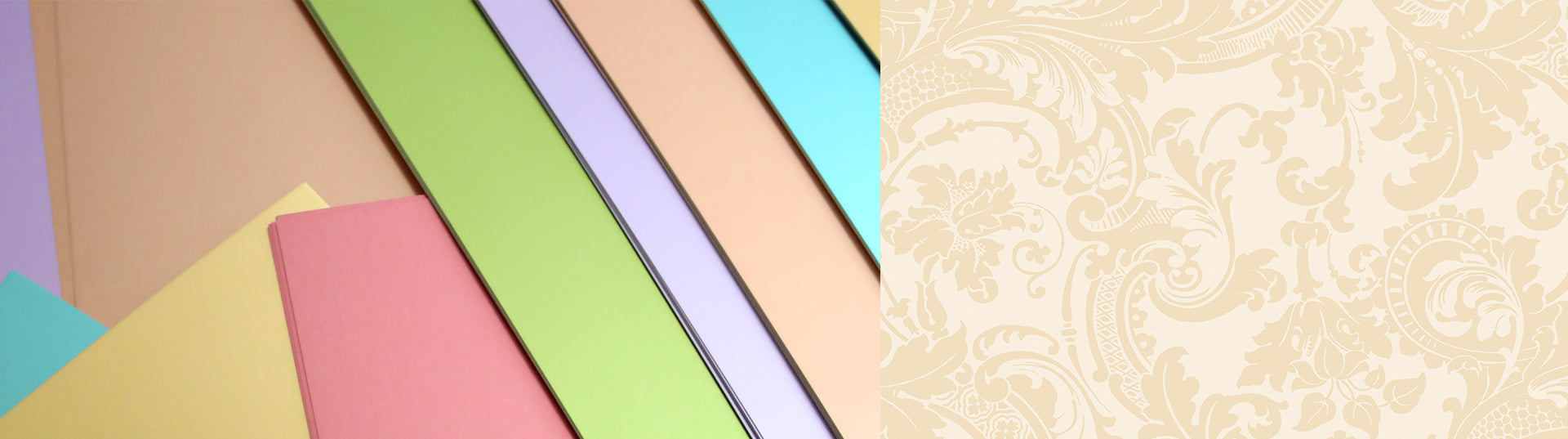 Various pastel-colored sheets of paper overlapped and arranged in a fanned-out pattern.