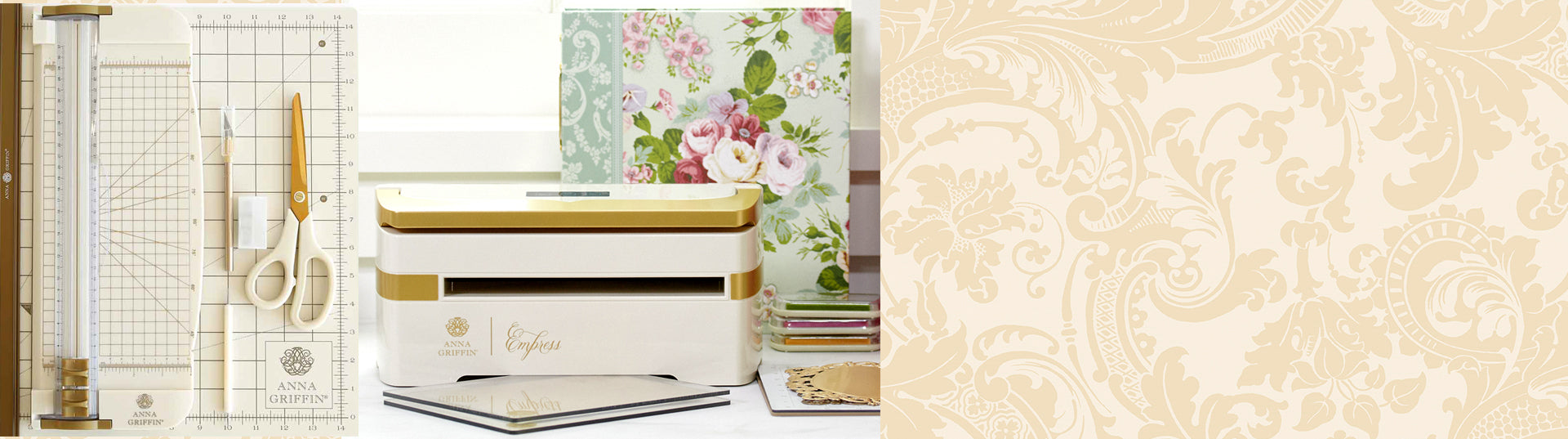 A white and gold crafting machine with the words "Anna Griffin Empress" on it, placed on a desk. There