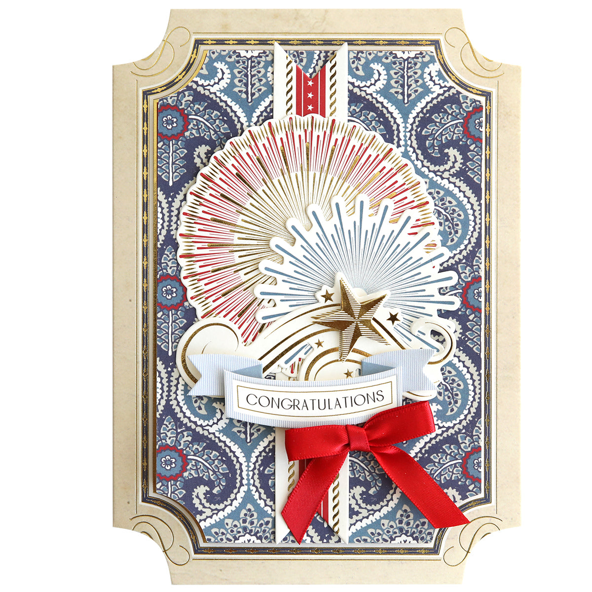 A decorative card featuring a fireworks design, gold star, 3D ribbons, and "Congratulations" on a blue and beige background—perfect for dimensional cards created with the Simply Celebration Chest Card Making Kit.