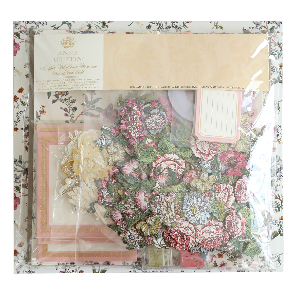 A pack of Simply Wildflower Meadow Scrapbook Kit, including patterned papers and embellishments, displayed in transparent packaging.