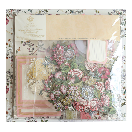 A pack of Simply Wildflower Meadow Scrapbook Kit, including patterned papers and embellishments, displayed in transparent packaging.