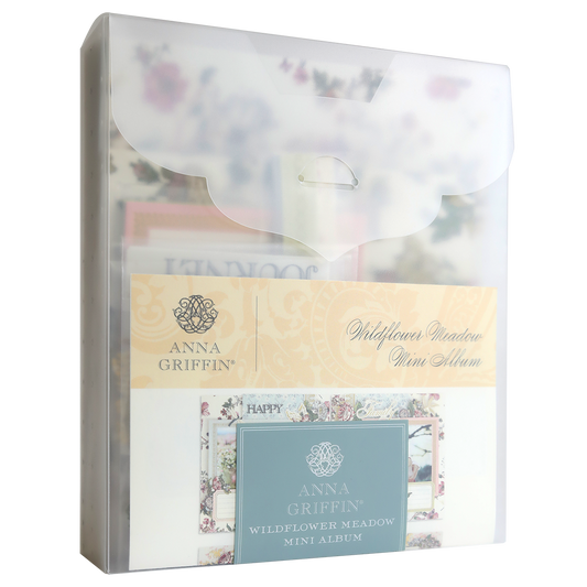 A translucent plastic envelope contains the Simply Wildflower Meadow Mini Album and Materials, featuring floral designs and decorative embellishments visible through the packaging.