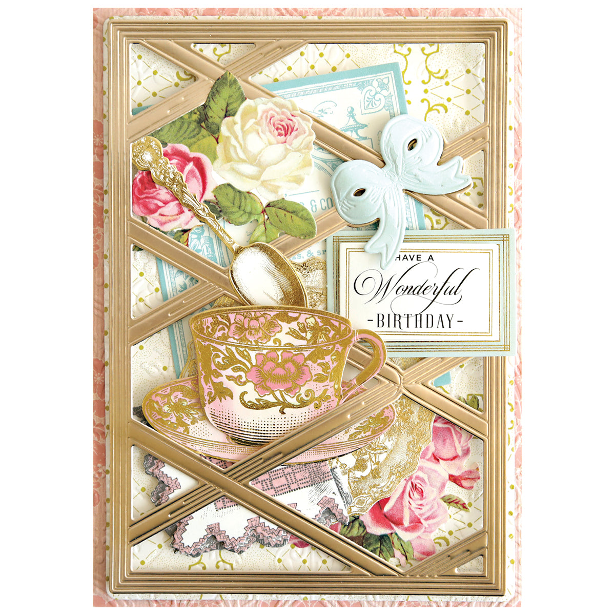 Greeting card made with Harlequin Bow Dies, featuring a pink and gold teacup, saucer, spoon, roses, blue bow, and "Have a Wonderful Birthday" sign on a decorative harlequin ribbon background.