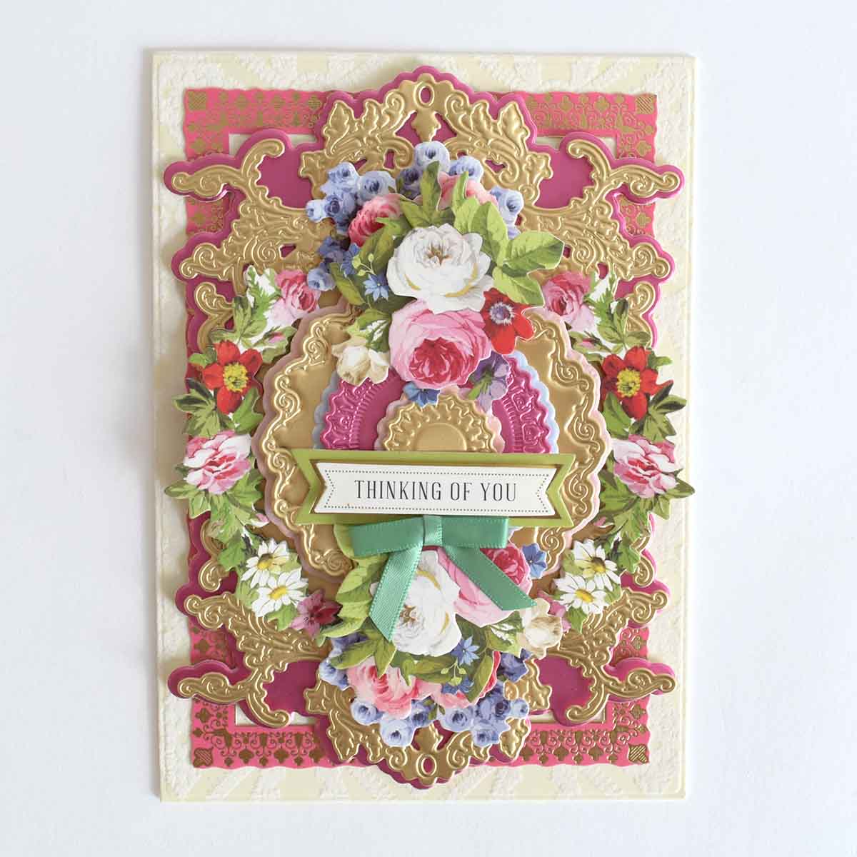 a handmade card with flowers on it.