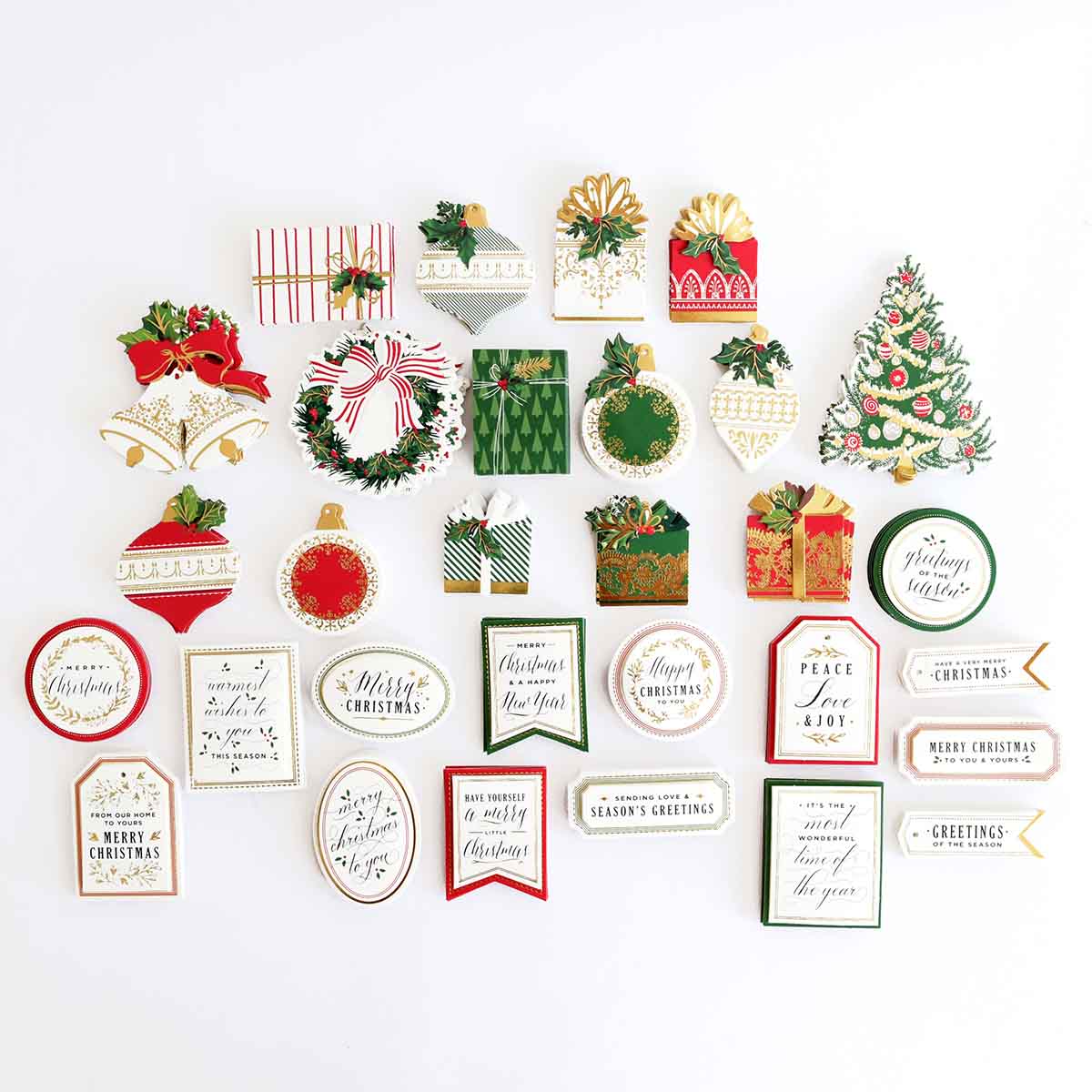a white wall with a bunch of christmas decorations on it.