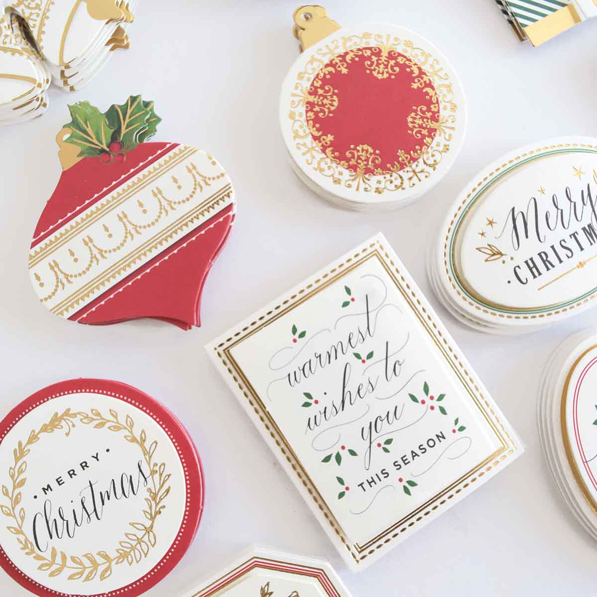 a table topped with lots of different types of christmas cards.