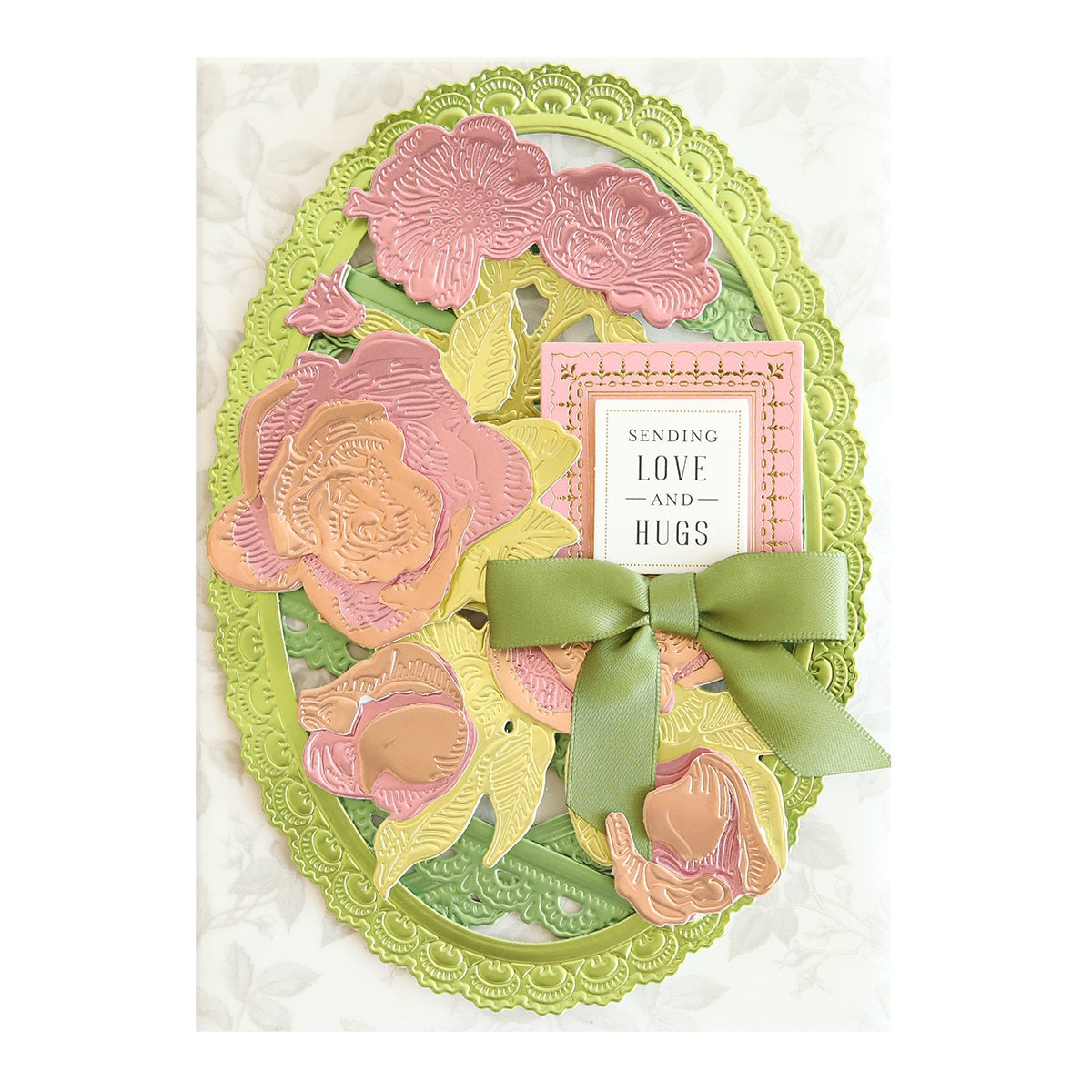 a card with flowers and a bow on it.