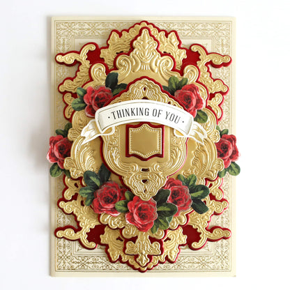a card with a gold and red design on it.