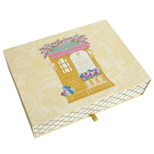 an open Flower Shop Easel Finishing School Kit with a picture of a building on it.