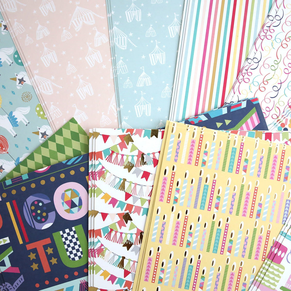 A collection of Birthday 12x12 Cardstock with different designs on them.