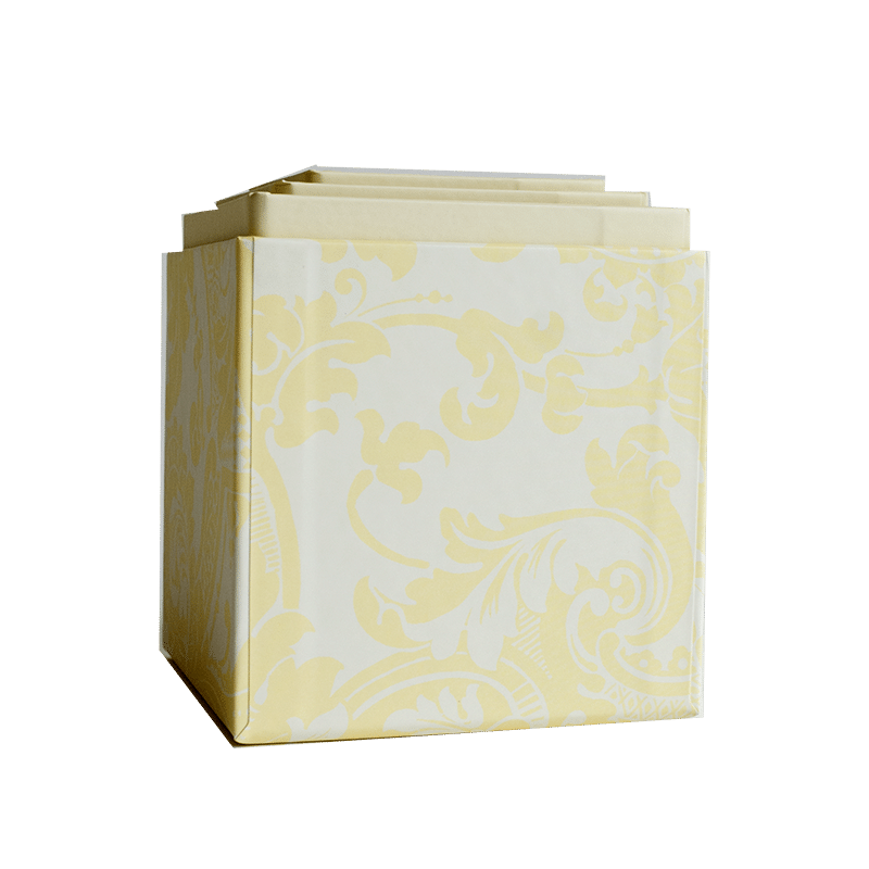 a yellow and white box with a pattern on it.
