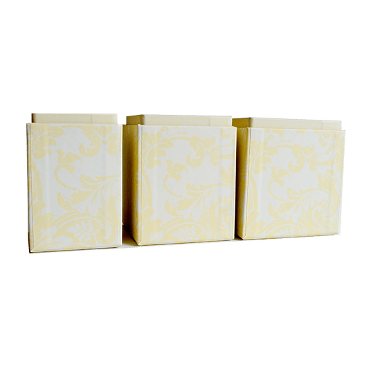 a set of three yellow and white paper bags.